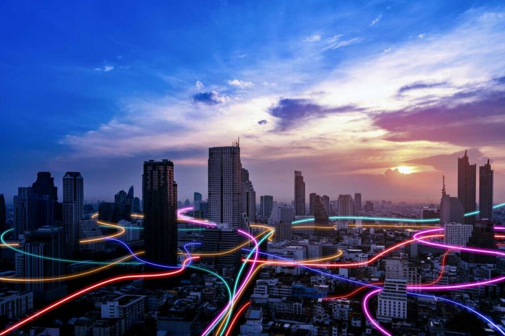 iStock-1445614323 Smart city with speed line glowing light trail surround the city. big data connection technology concept.